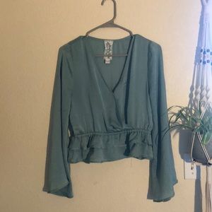 Teal long sleeve blouse with ruffle bottom